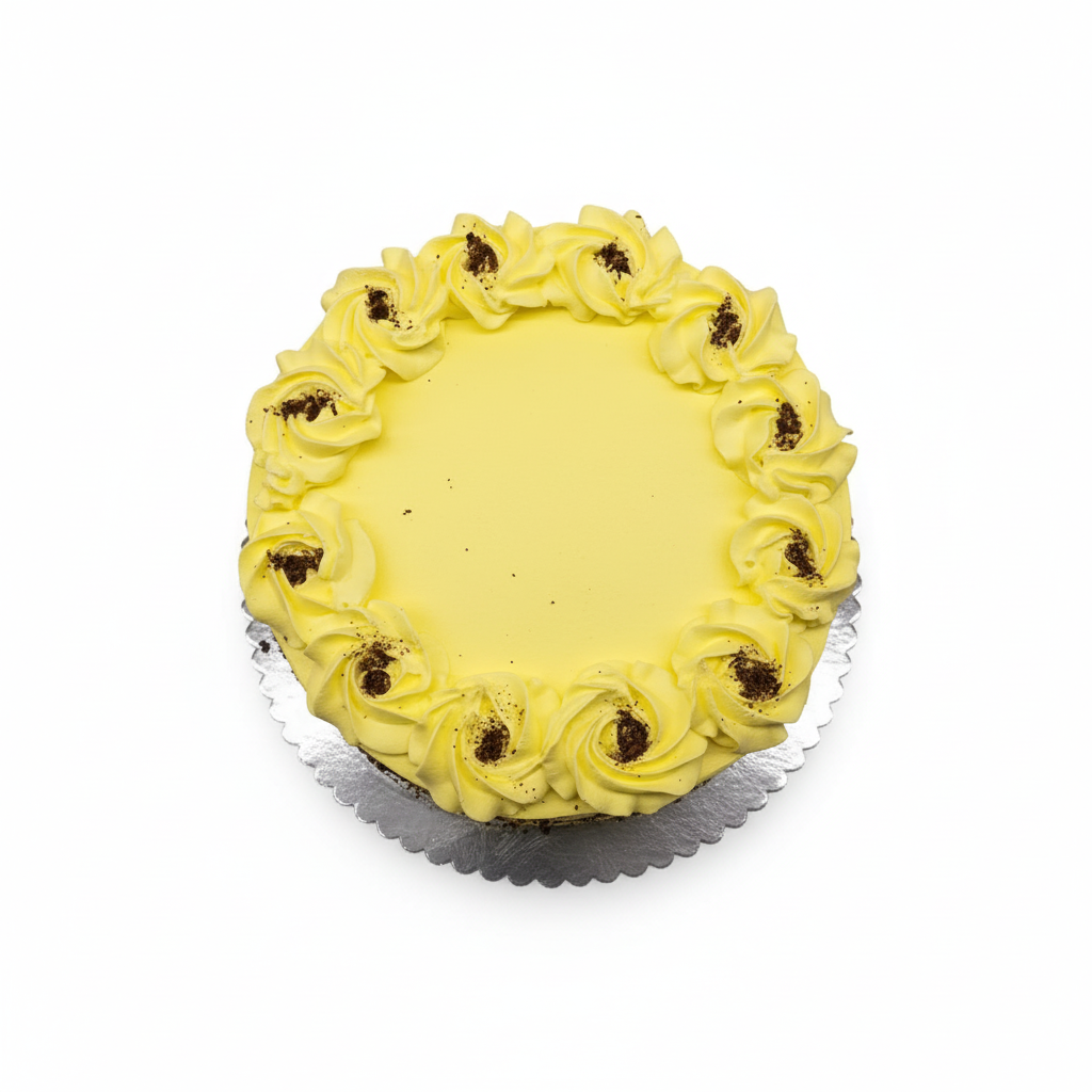 Round yellow eggless Rasmalai cake with piped yellow rosettes along the edge